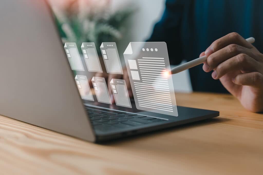 A businessman reviews the steps using a virtual online document